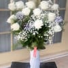 Fresh as  fallen snow! Snowy white premium roses are decorated with