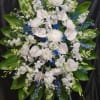 Blue delphiniums,  white stock.  White Cremons,  white anthuriums and