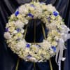Memorial wreath- All white with touches of another color. &mdash; pictured is