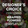 A beautifully wrapped bouquet designed with fresh, seasonal holiday blooms, hand selected