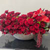 A lavish display of 200 deep red roses with red spray roses