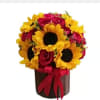 Beautiful arrangement of fresh roses and sunflowers in a cardboard base, perfect