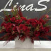 &bull; &ldquo;Elegant red rose arrangement, rich and romantic.&rdquo;
