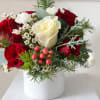Celebrate the season with Holiday Harmony, a beautifully balanced floral arrangement that