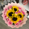 4 sunflowers paired with a full dozen of pink roses 