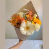 Beautiful bouquet featuring a mix of flowers in white, peach, and yellow