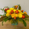 Glass vase with yellow garden roses
