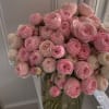 100 pink roses in a glass vase