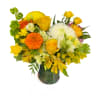A bright, energizing mix of yellow roses, marigolds, alstroemeria, lisianthus, chrysanthemums, solidago