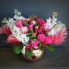 This luxury arrangement contains mixed florals such as roses, garden roses, hydrangeas