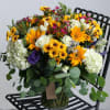 This luxury arrangement contains mixed florals such as sunflowers, roses, hydrangeas, freesias