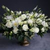 This elegant arrangement contains premium mixed florals, beautifully laid out in a