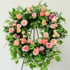 Beautiful and full wreath standing spray. Inlcudes seasonal blooms and foliage. Can
