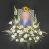 A beautiful accent of all white flowers adorns a customer-provided picture of