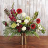 A beautiful arrangement arrives in a gold vase perfect for the season!