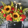 Introducing our design Surprise Me! Beautifully arranged with sunflowers, roses , delphiniums