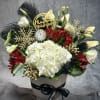 A luxurious New Year arrangement featuring lush white hydrangeas, rich red blooms