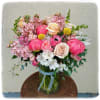 This arrangement is full of color. It has it all! Peonies, roses