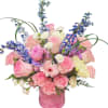 A delicate and elegant flower box featuring soft pink roses, carnations, gerbera