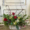 An oblong metal container embossed with mini hearts is designed for the