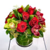 A dozen red roses with elegant cymbidium orchid blooms. Half of the