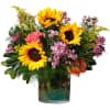 Brightly colored flowers like sunflowers, roses, solidago and wax flower are complimented
