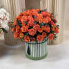 Vibrant and bold, our orange flower arrangements in a box ignite joy