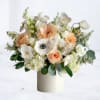 The Dove Grace Bouquet is a refined arrangement of soft peach roses