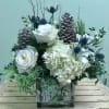 Celebrate the season with this arrangement in cool shades of white, blue