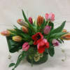 A beautiful selection of mixed spring tulips, arranged in a simple cylinder