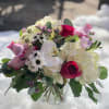A beautiful collection of hydrangeas, roses and more, arranged with the nicest