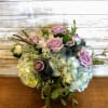 Make their day shine with this lush bouquet of hydrangea and roses