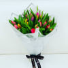 Gorgeous bouquet of assorted color Tulips in a modern wrapping 