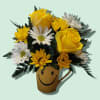 Yellow and white daisies fill this smiley face mug with two roses
