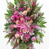 oriental pink lilies, orchids, roses, carnations. stock and  larkspur etc on