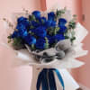 A hand-tied bouquet featuring 12 stunning blue roses, elegantly wrapped in luxurious