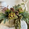 Natural wooden box, evergreen, juniper, pinecone and green velvet ribbon. An arrangement