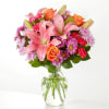 A carefully selected blend of roses, daisies, and lilies make for a