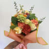This vibrant bouquet, perfect for any occasion, combines the fiery energy of