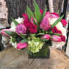 A beautiful stylish cube style arrangement with premium  flowers such as