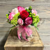 This beautiful vase is a compact style arrangement featuring 12 roses of
