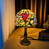 This beautiful tiffany memory lamp features a hummingbird and pastel color florals.