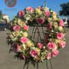 An elegant wreath arrangement crafted with care, symbolizing eternal love, peace, and