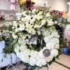 An elegant wreath arrangement crafted with care, symbolizing eternal love, peace, and