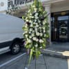 A standings flower arrangement for a funeral service is a heartfelt tribute