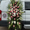A standings flower arrangement for a funeral service is a heartfelt tribute