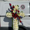 A cross stand for a funeral is a graceful tribute, symbolizing faith