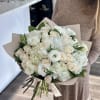 Classic white bouquet featuring white roses, soft hydrangeas, and delicate lisianthus. An
