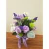 A Soft dreamy mix of lavender flowers expertly arranged in a vase