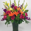 A colorful mix that includes Glad, Lilies, Roses and stock. A great